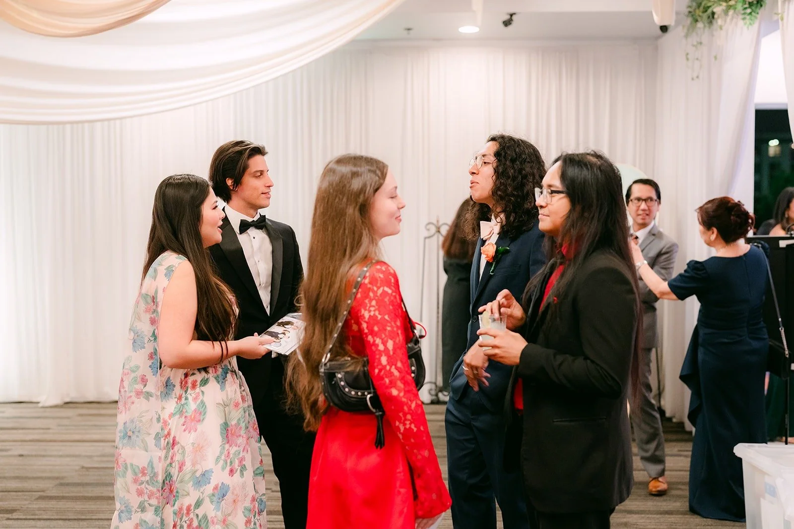Friends lining up to take photos with the couple