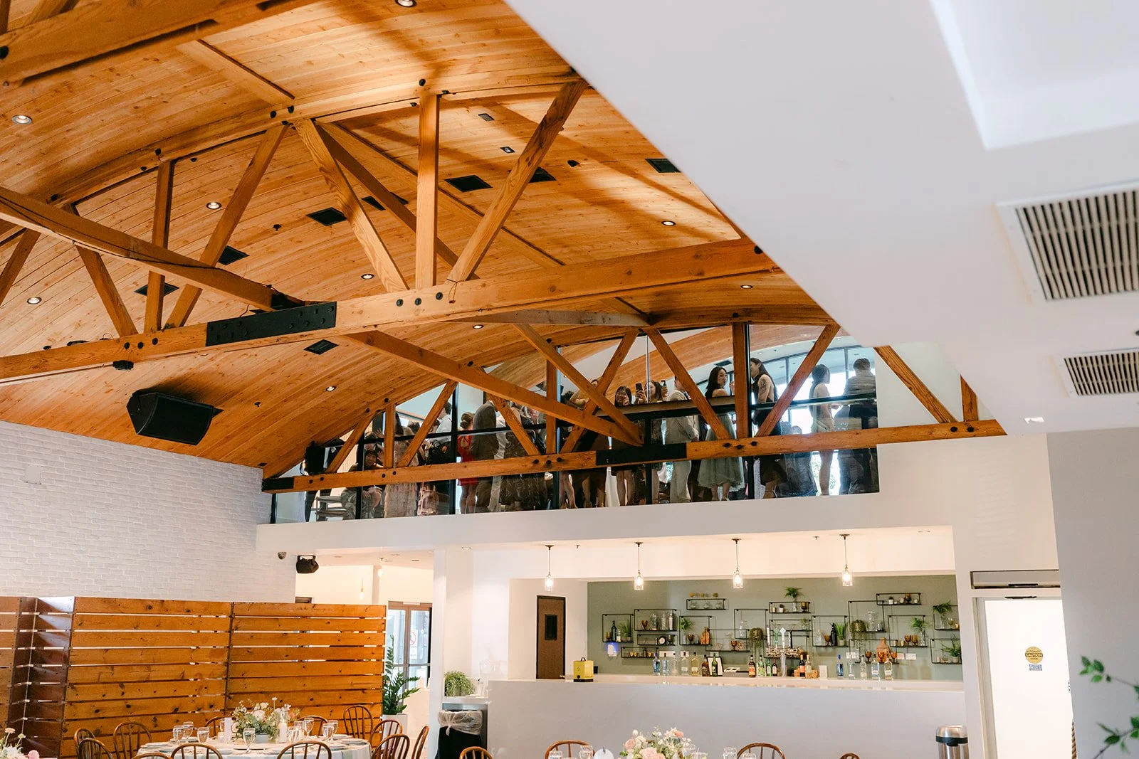 The Great Hall at The Colony House in Anaheim with its wood trusses and loft bar