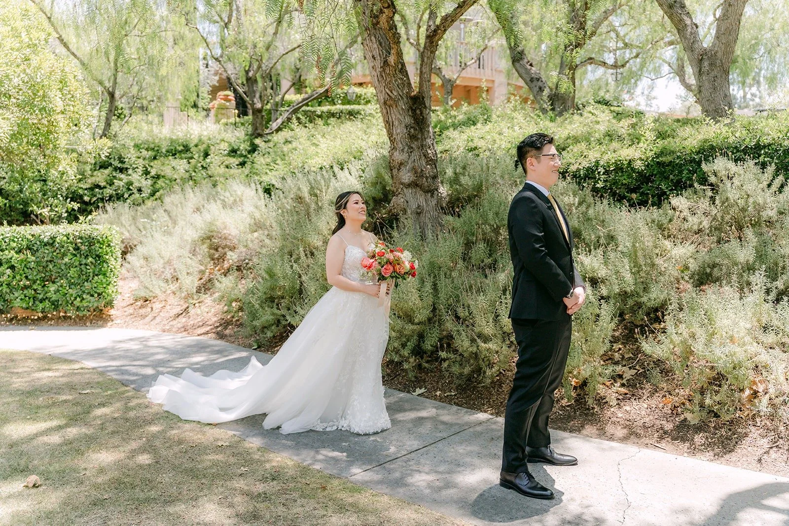 Zach waiting with his back turned on the patio path for the first look at Rancho Bernardo Inn