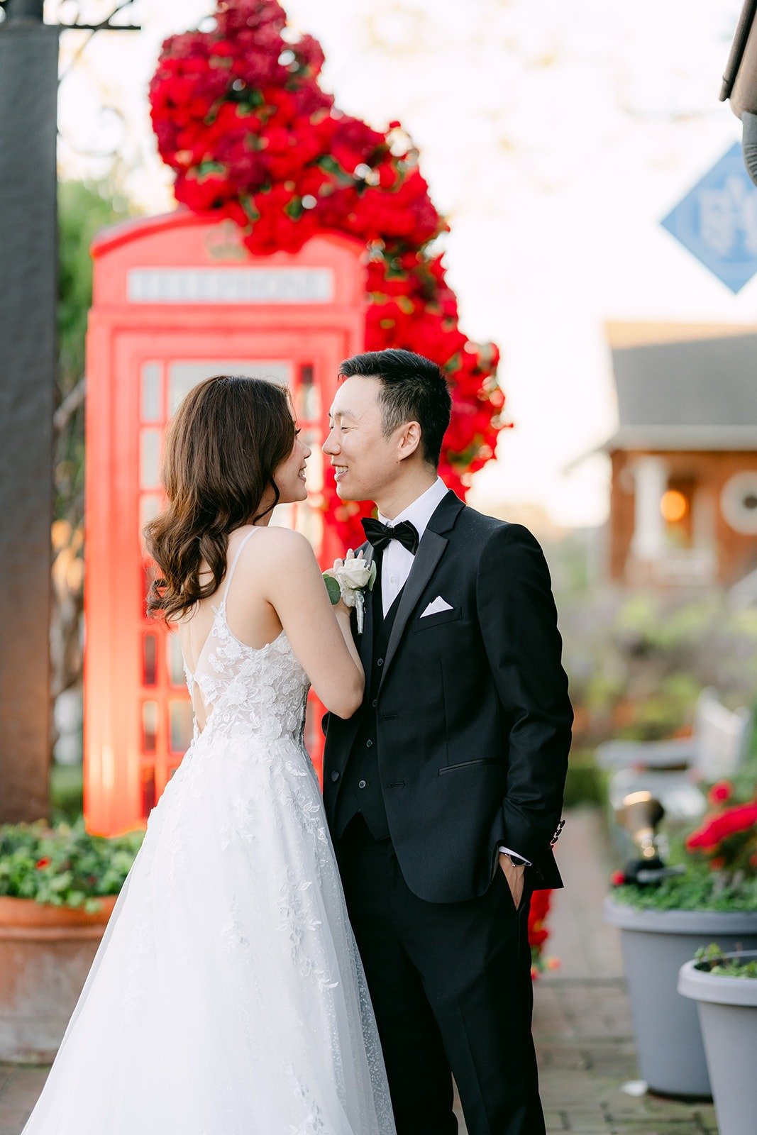 Valerie and Jason sharing a moment by the phone booth