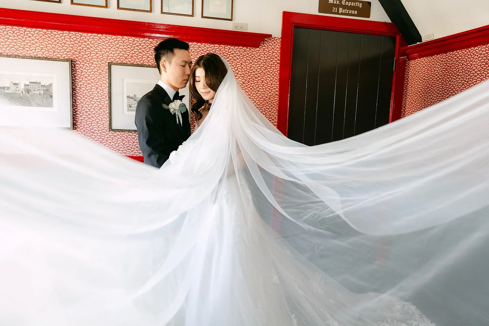 Valerie's long veil sweeping across the floor as Jason holds her close