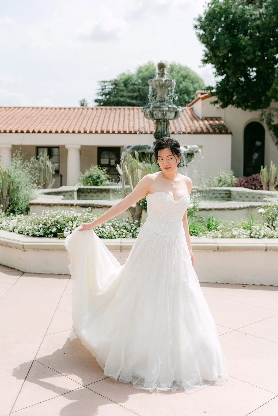 Eunice swirls the train of her gown on the plaza