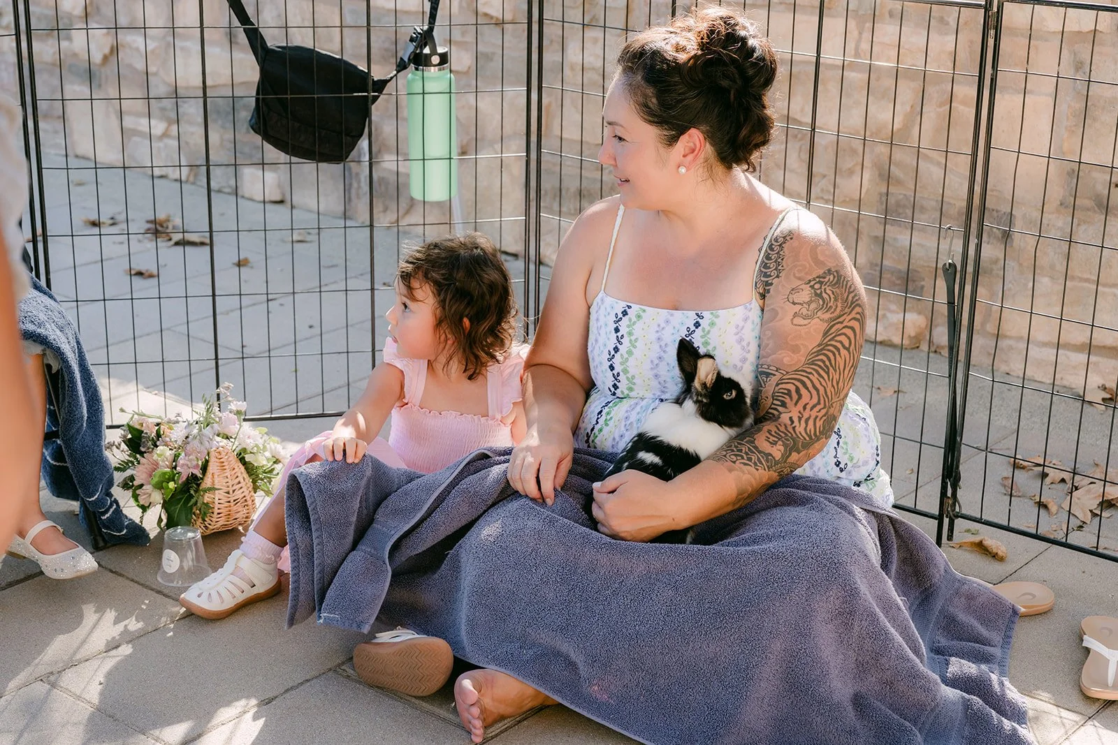 Guests visiting the small animals pen on the patio at Quail Hill Community Center.