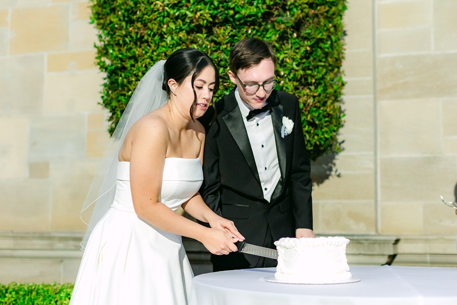 Brianna and Nik getting ready to cut their cake