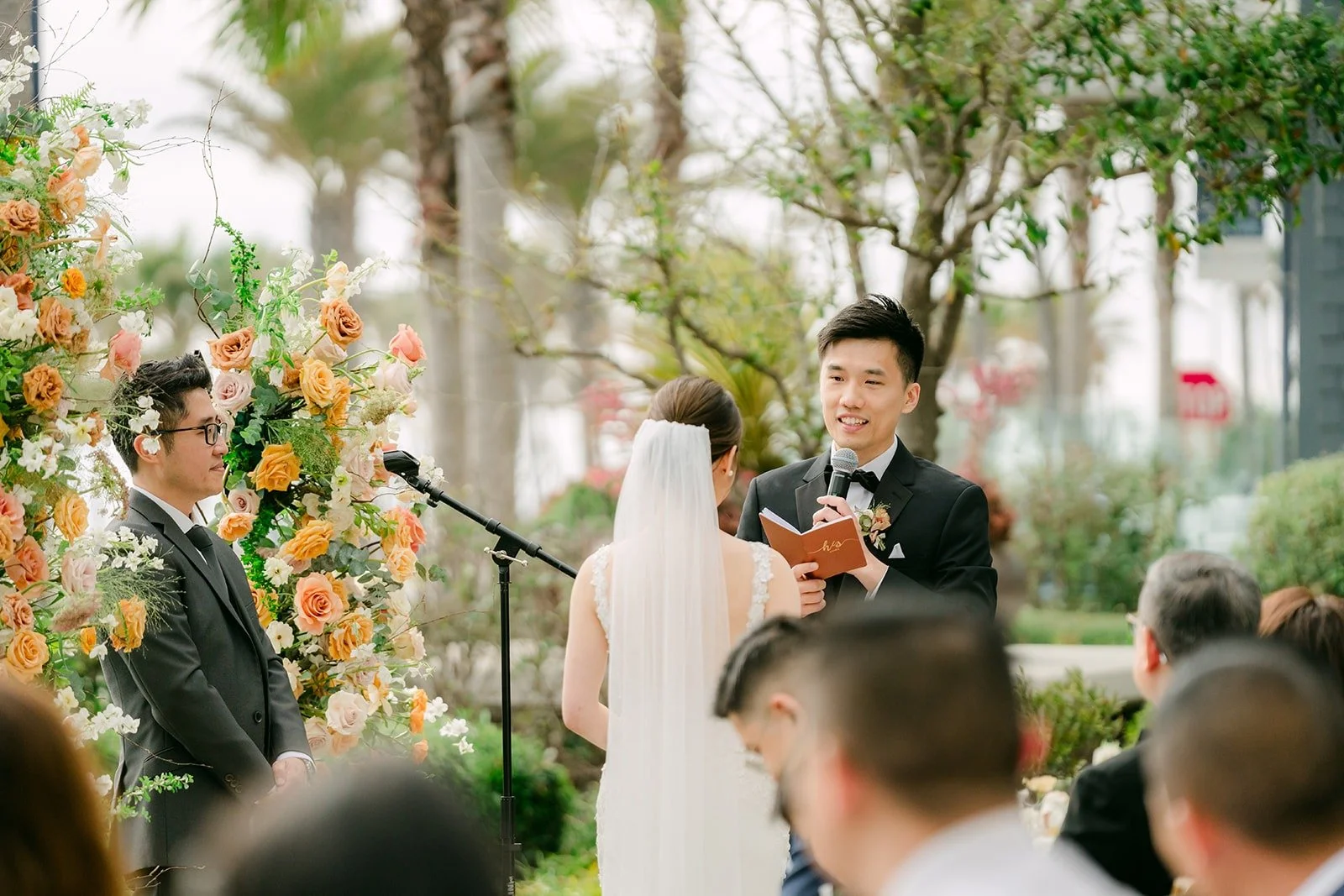 Eli reading his vows to Angela during the ceremony
