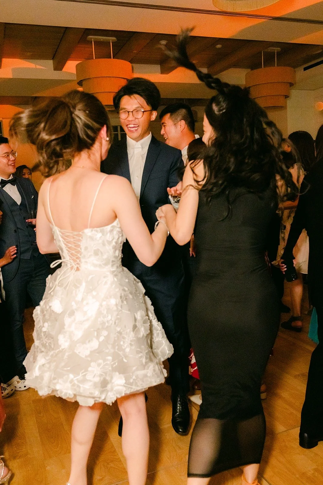 Angela and Eli in the middle of a packed dance floor