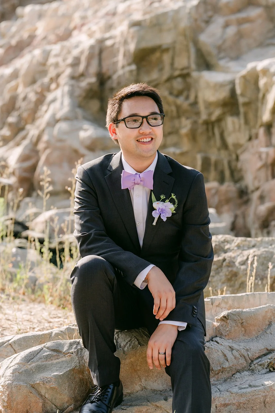 Patrick smiling by the waterfall