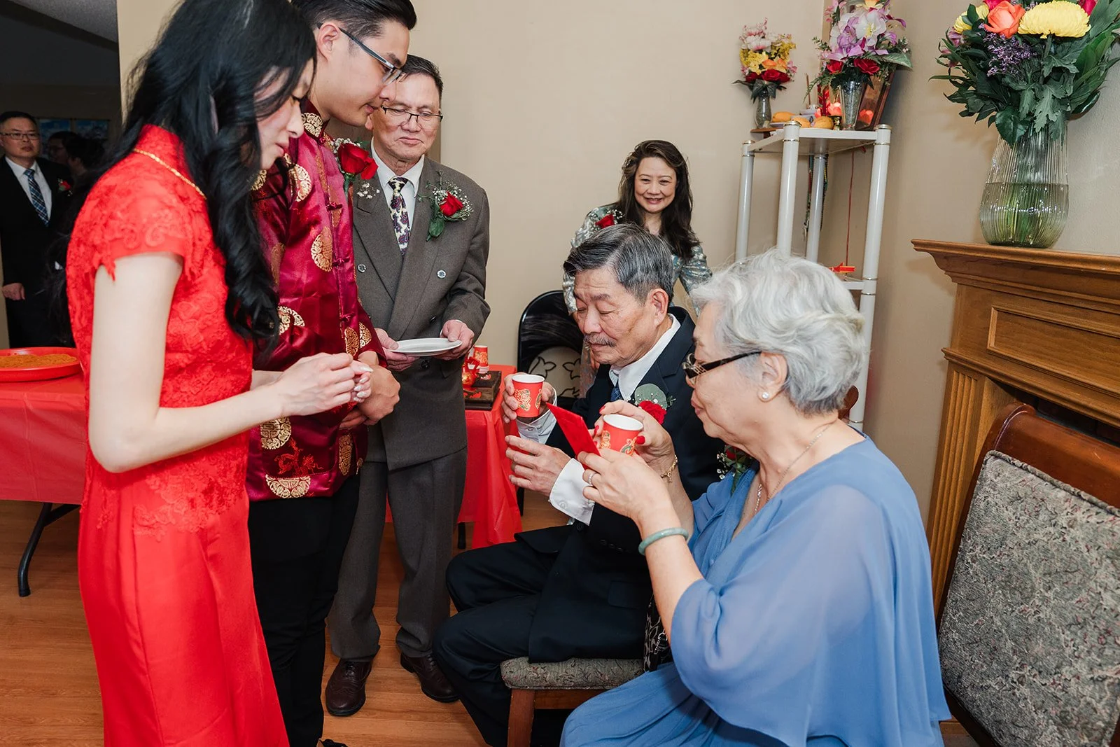 A grandmother receiving tea from the couple.