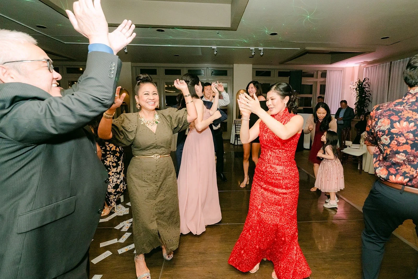 Guests throwing their hands up on the dance floor