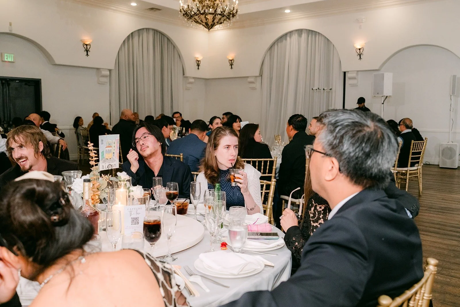 Guests at their tables listening to the speeches