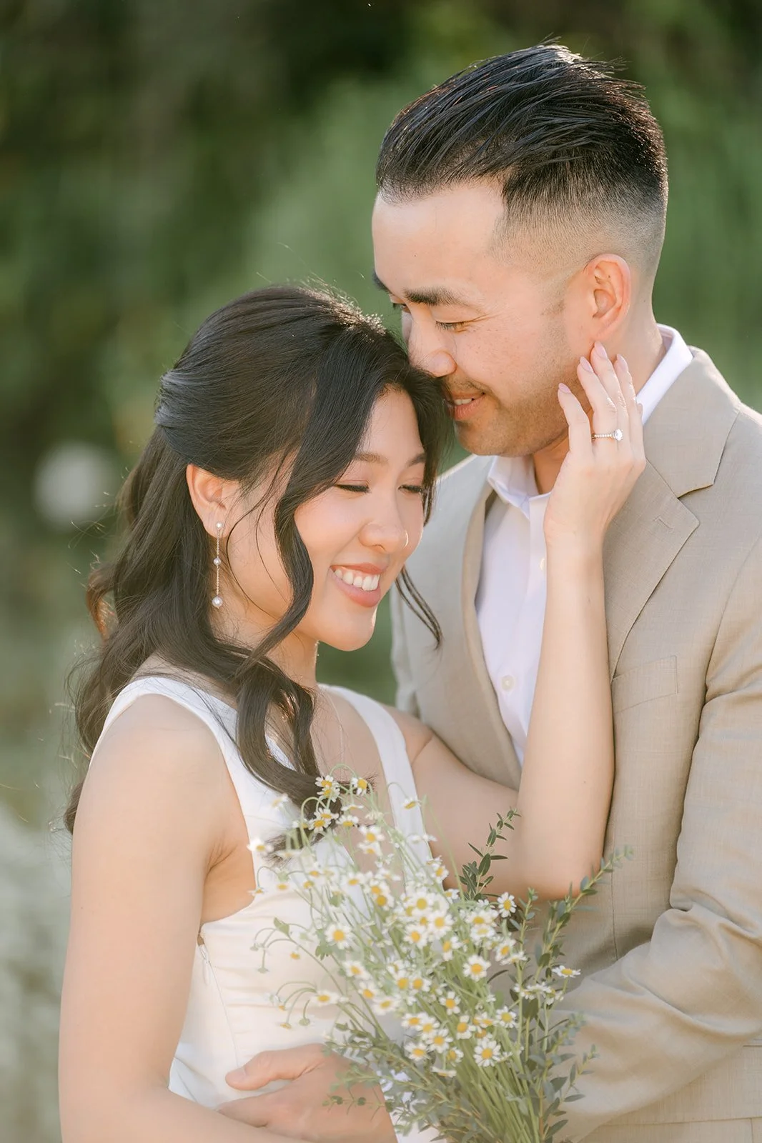 Vincent kisses Kim's forehead as she smiles.