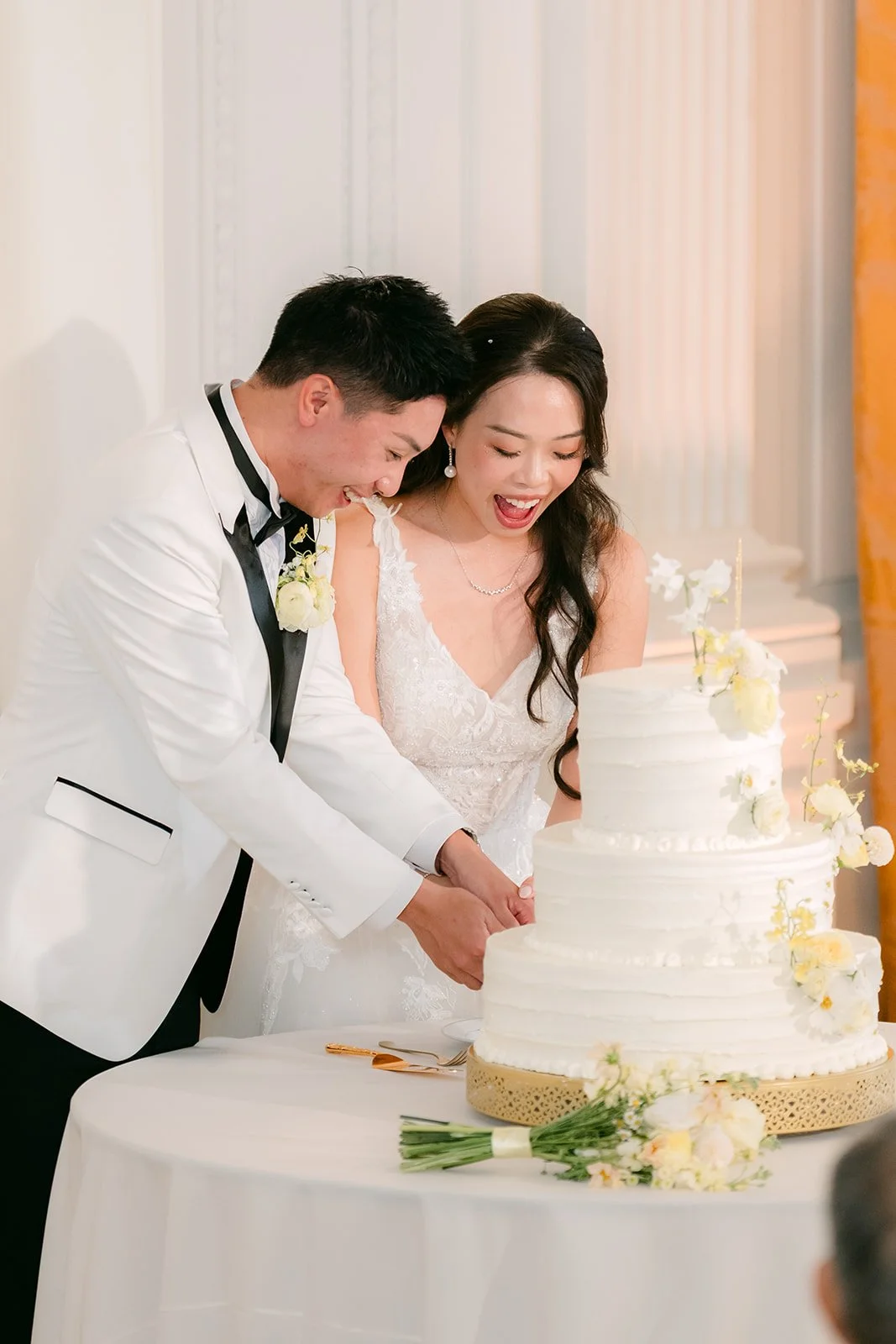 Jenny and Ryan cutting the cake.