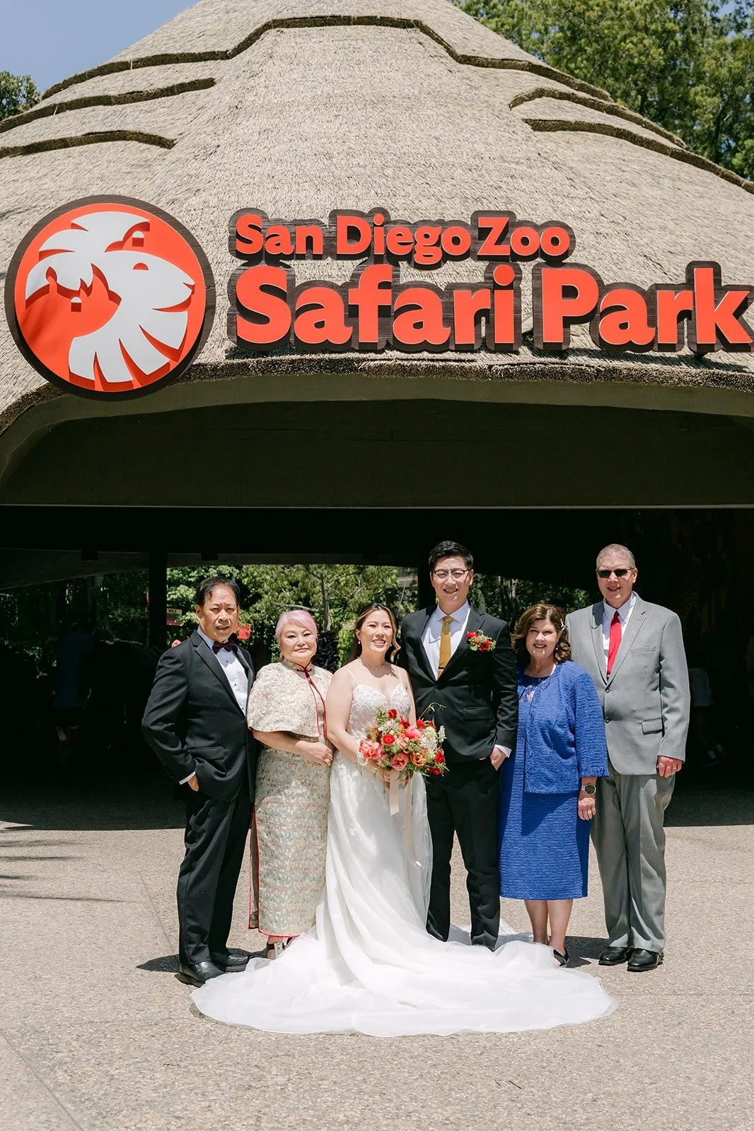 Joanne and Zach with family members under the Safari Park entrance sign