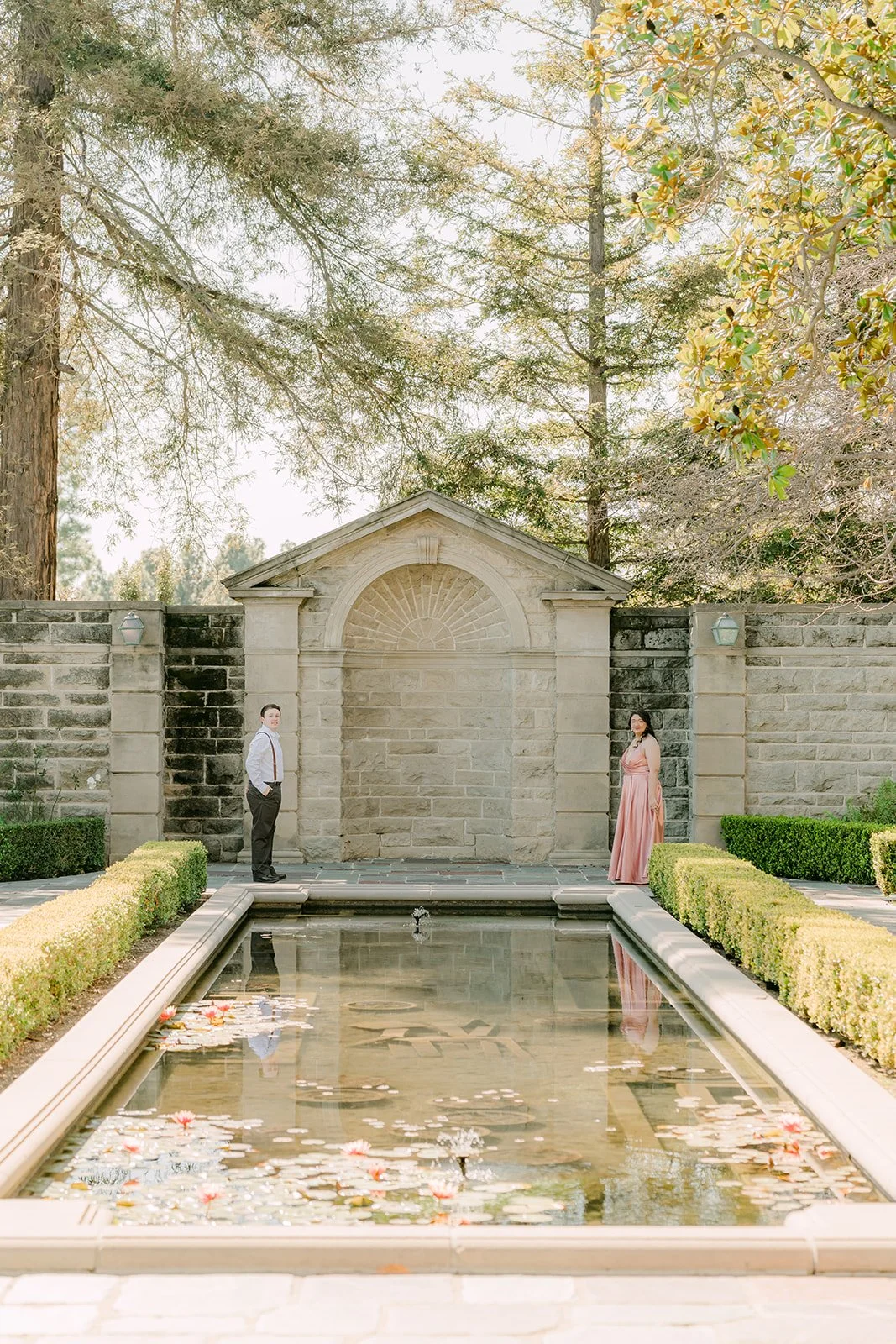 The lily-filled reflecting pool leading to the stone pavilion at Greystone Mansion.