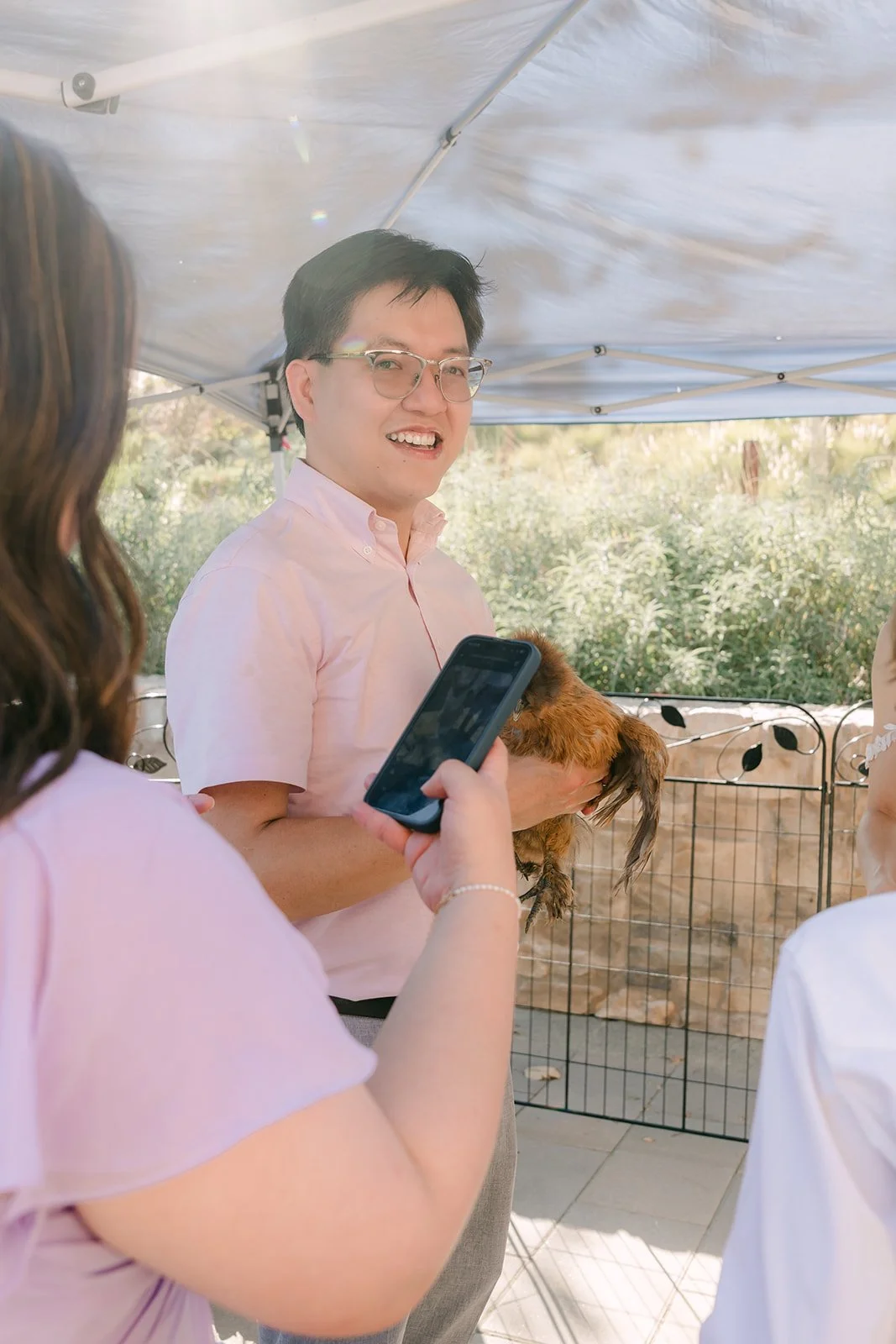A guest holding a small animal at the encounter.