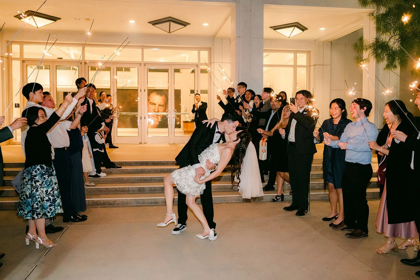 Guests lining up outside for Jenny and Ryan's grand exit.