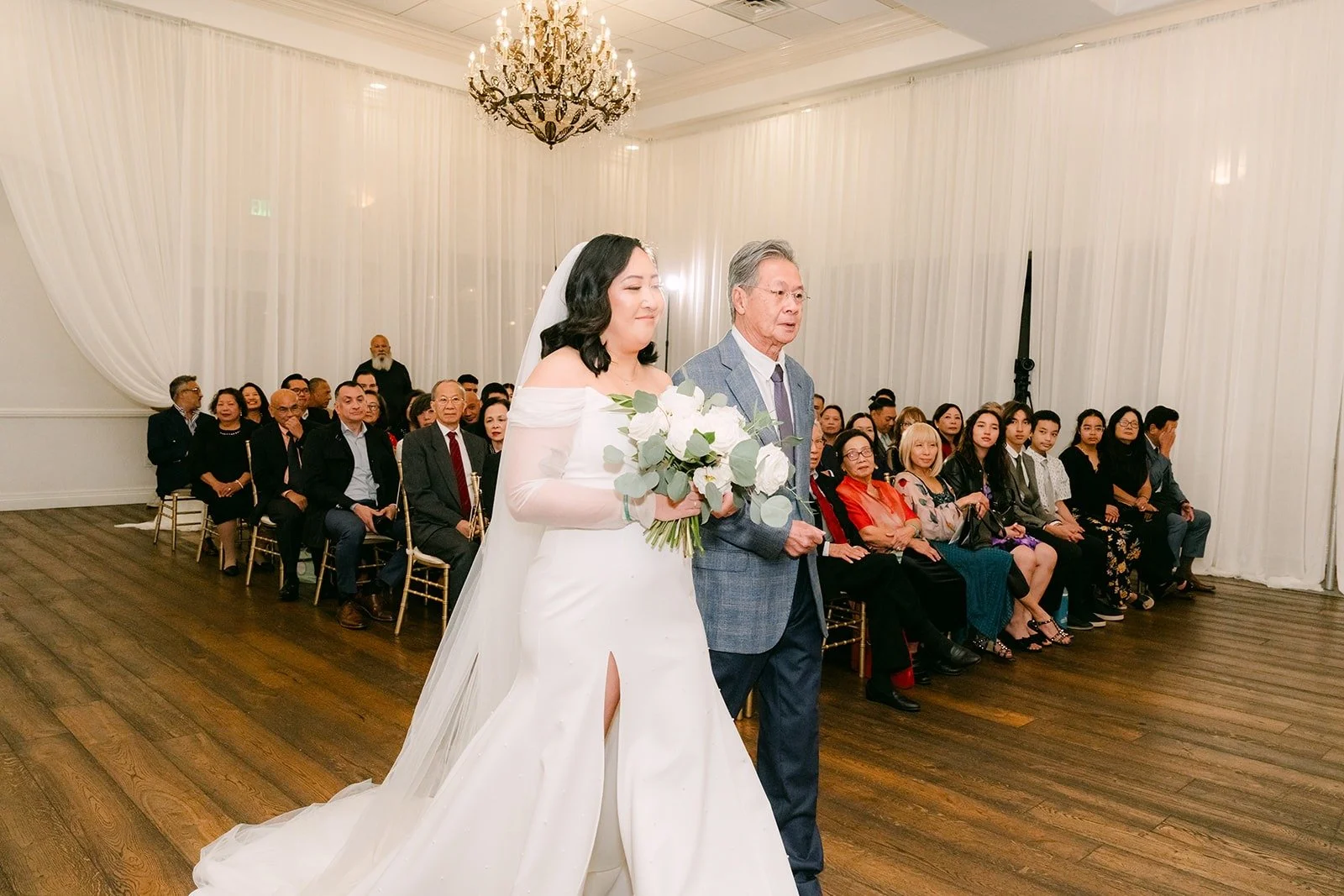 Vivian walking down the aisle with family