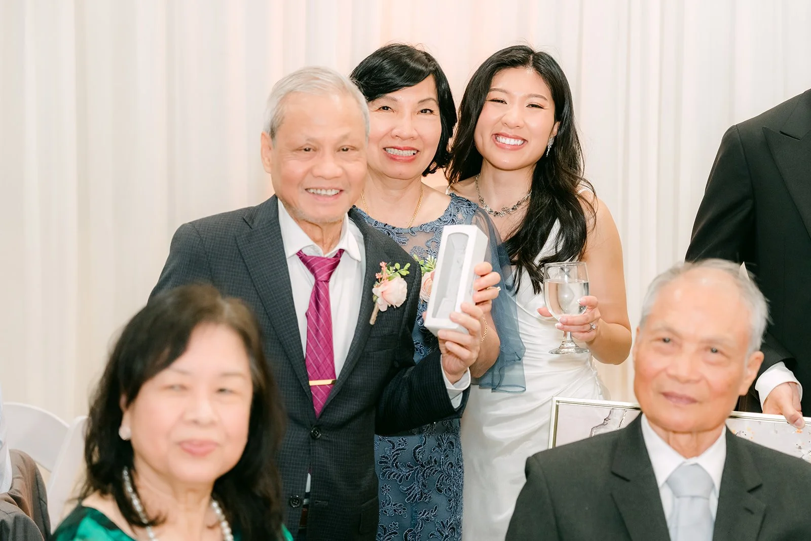 Family greeting Kim and Vincent at their table