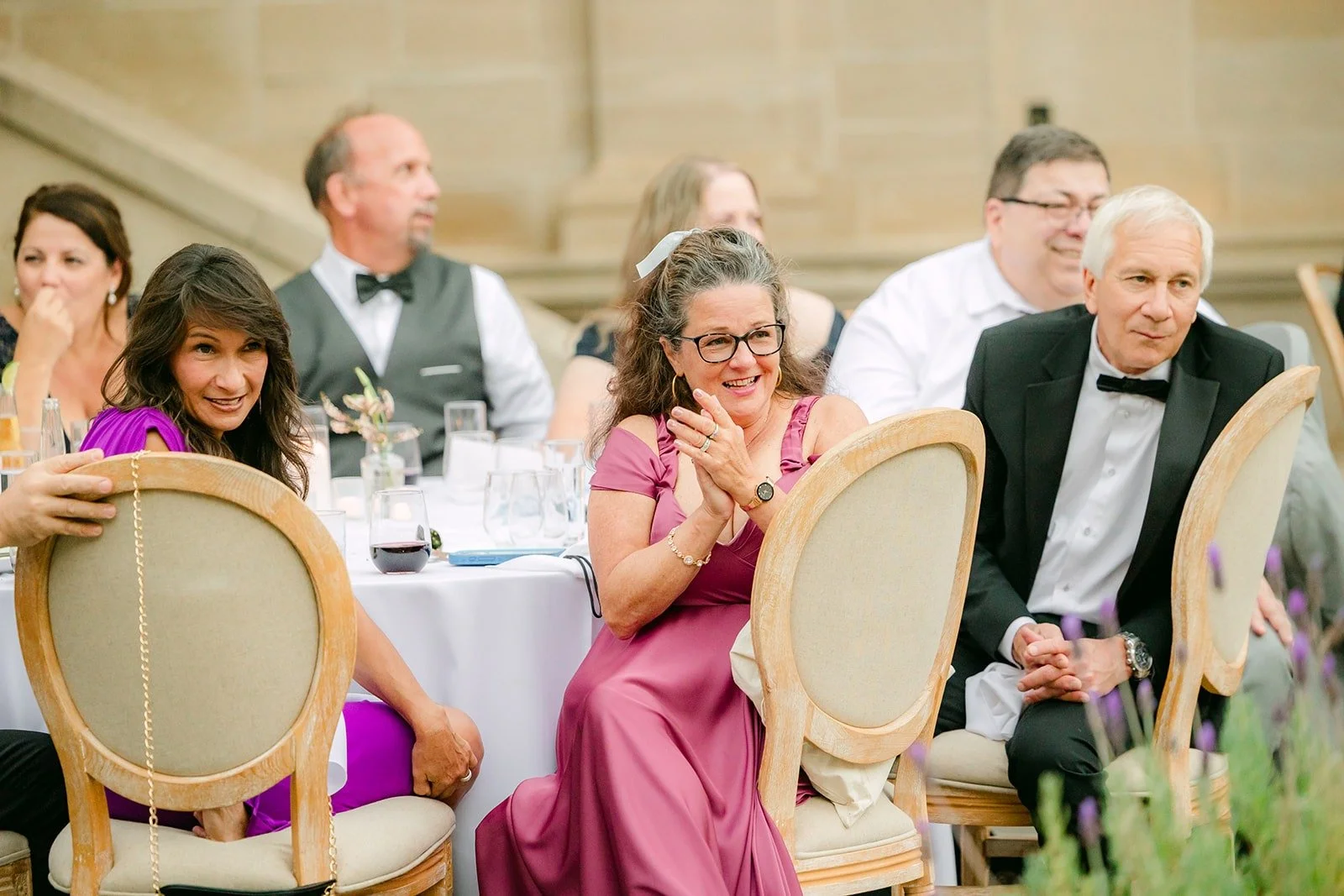 Guests raising their glasses in the courtyard