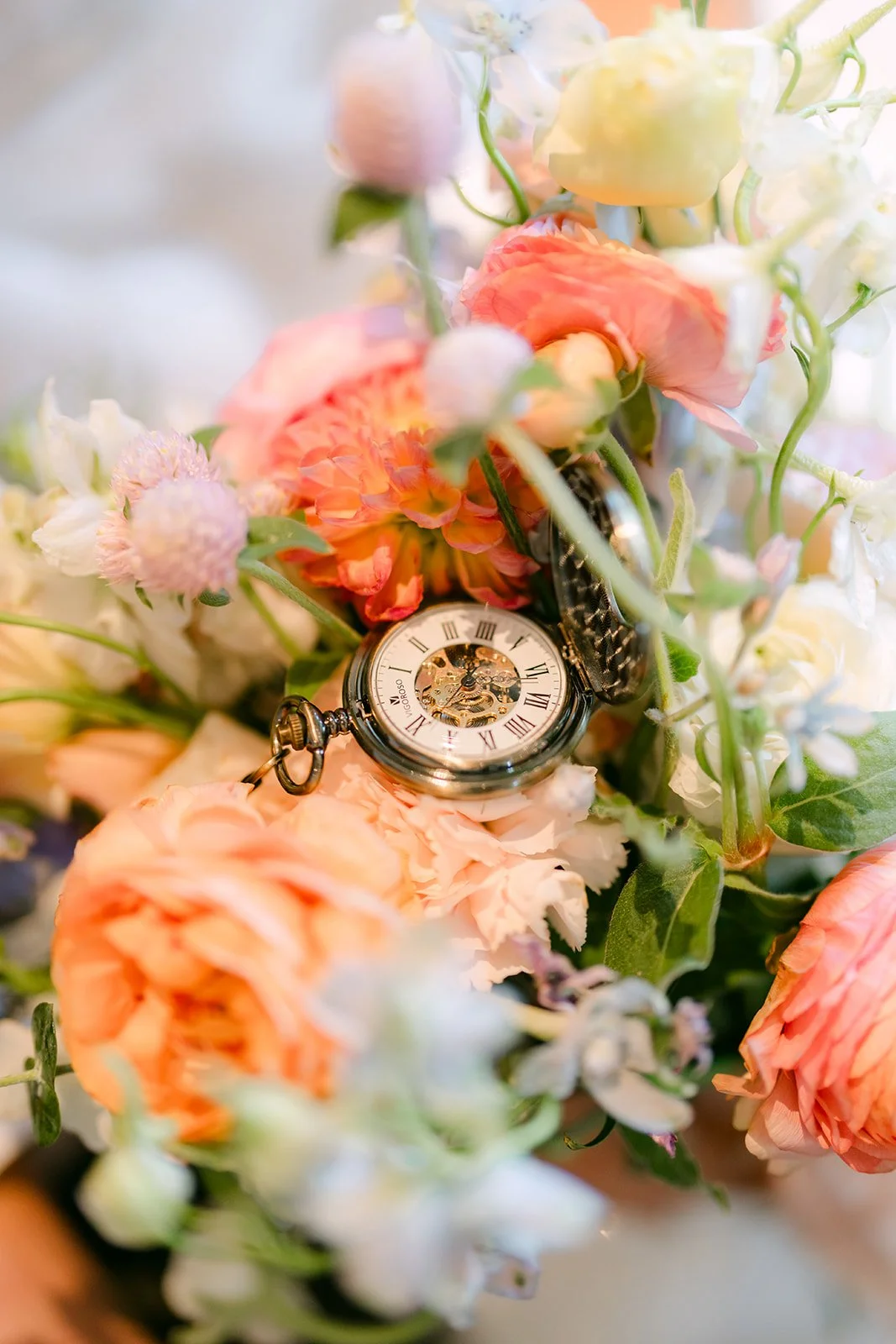 Bouquet of peach roses with Alex's pocket watch