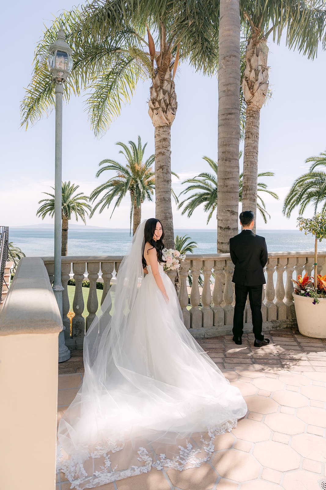 Bride walking toward Kai for their first look on the terrace