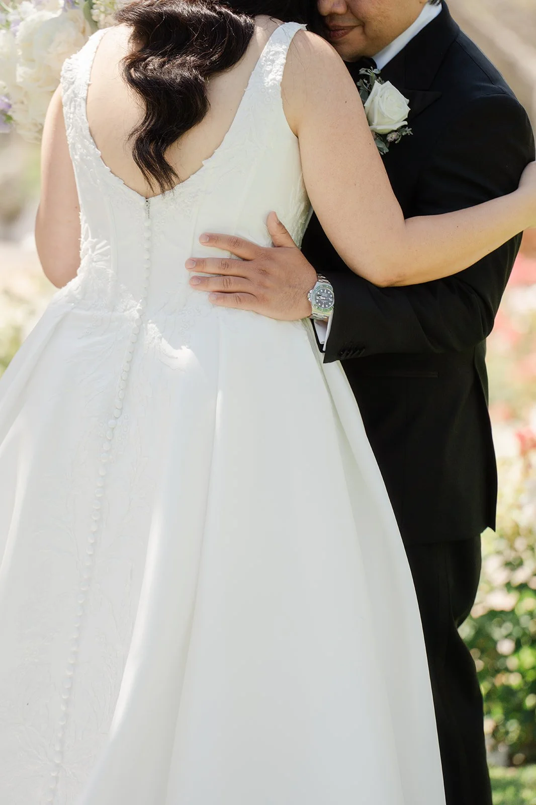 Groom embracing the bride after their first look