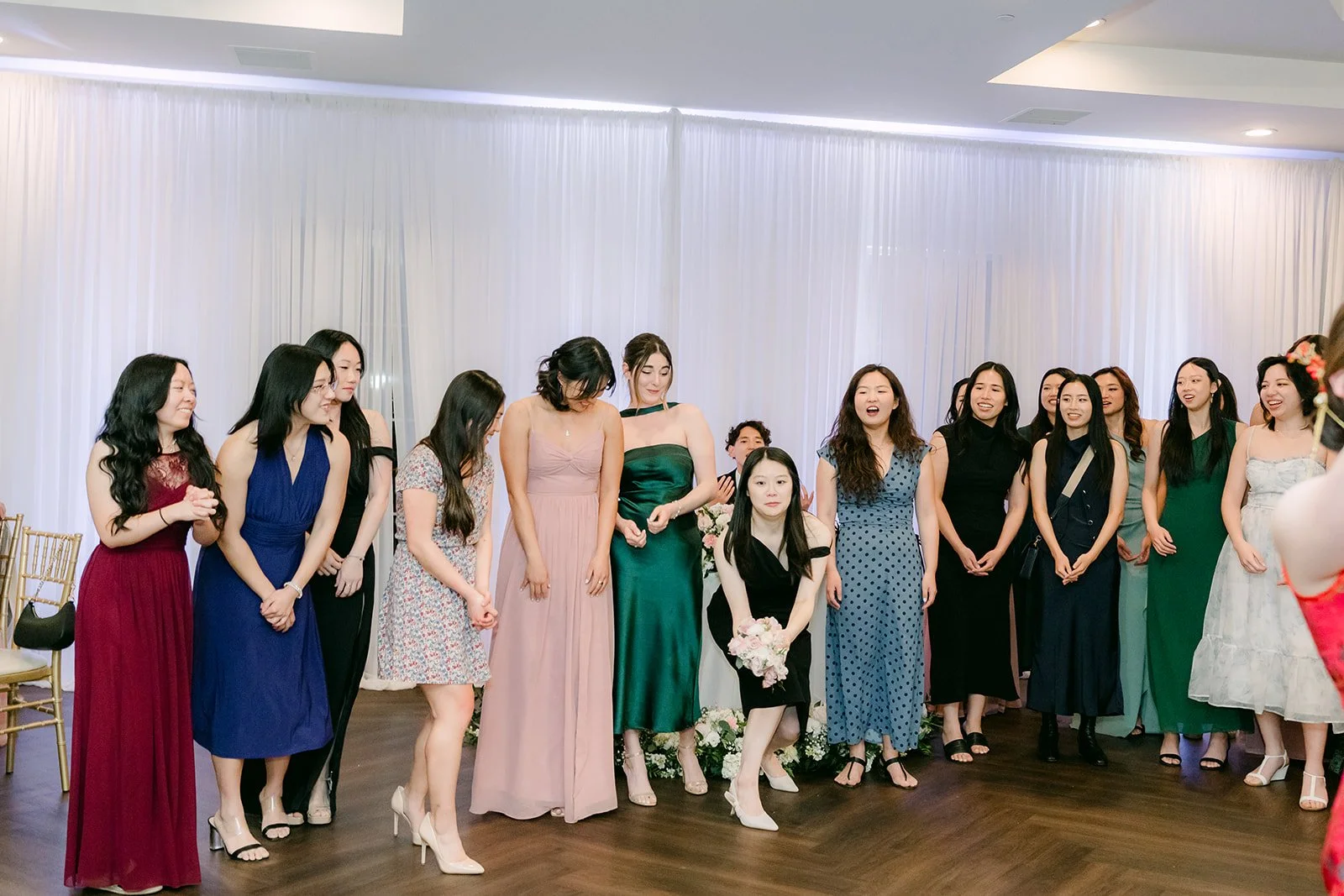 Guests lining up for the bouquet toss