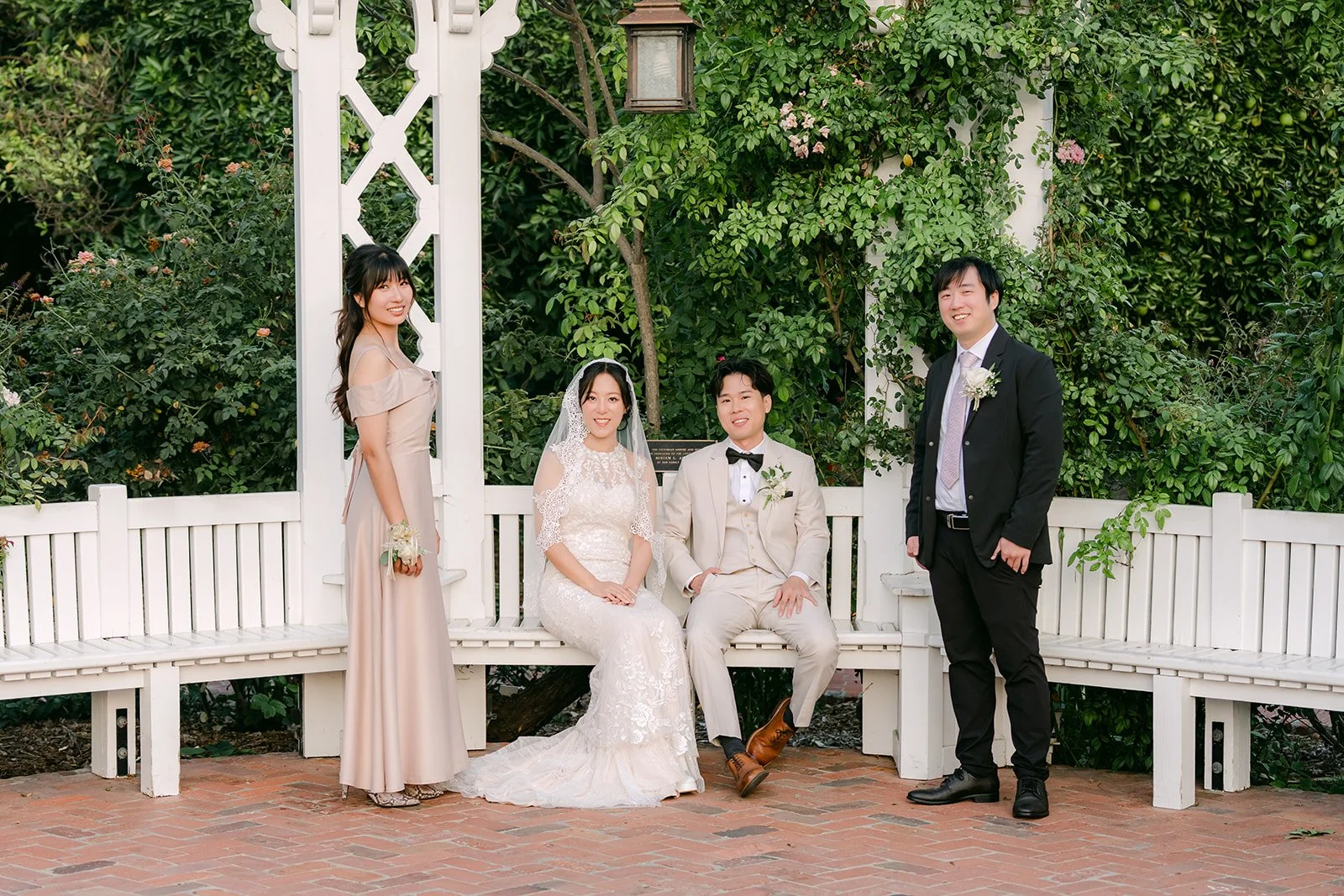 Elaine and Wen seated at the pergola with Kathleen and Henry.