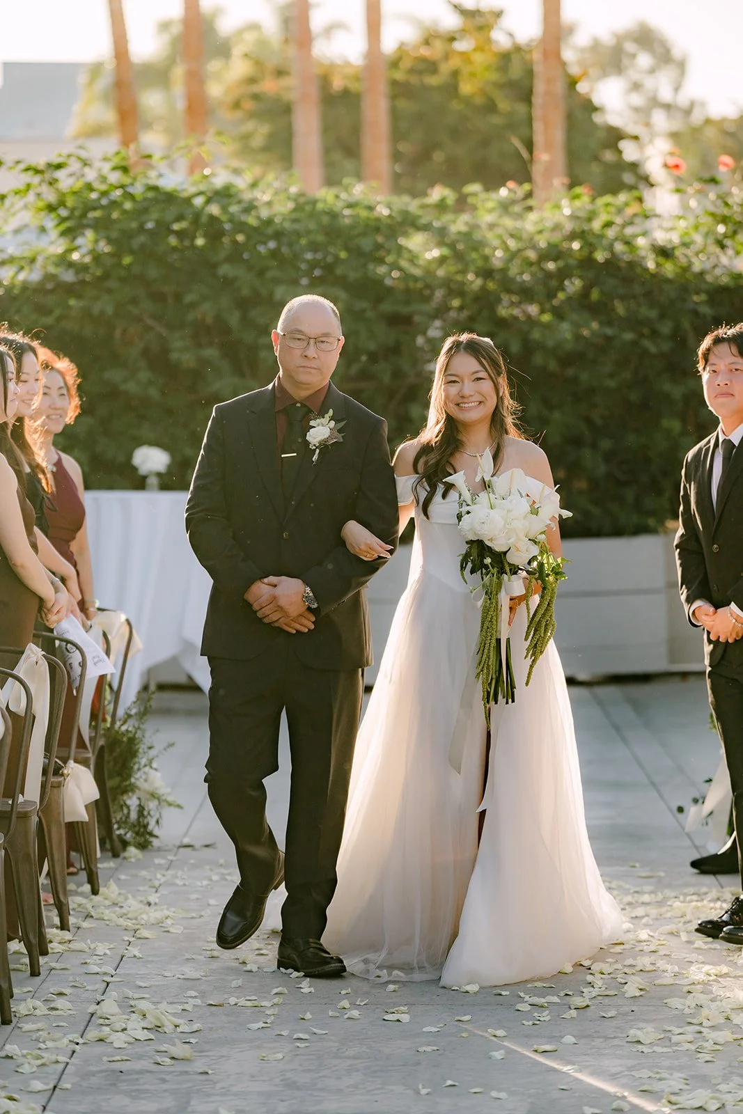 Jadee walking down the aisle with her father