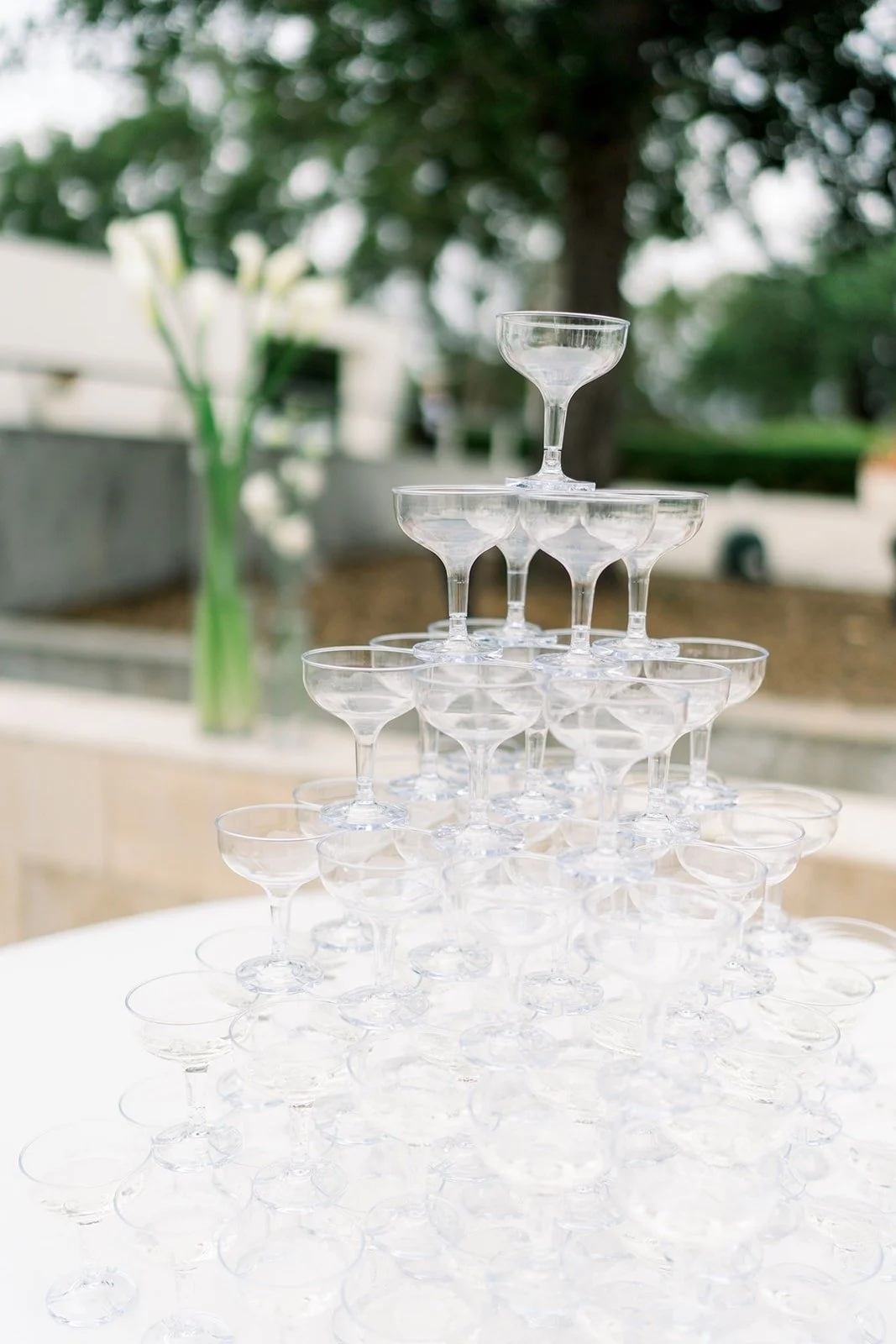 The champagne tower beside a white orchid arrangement