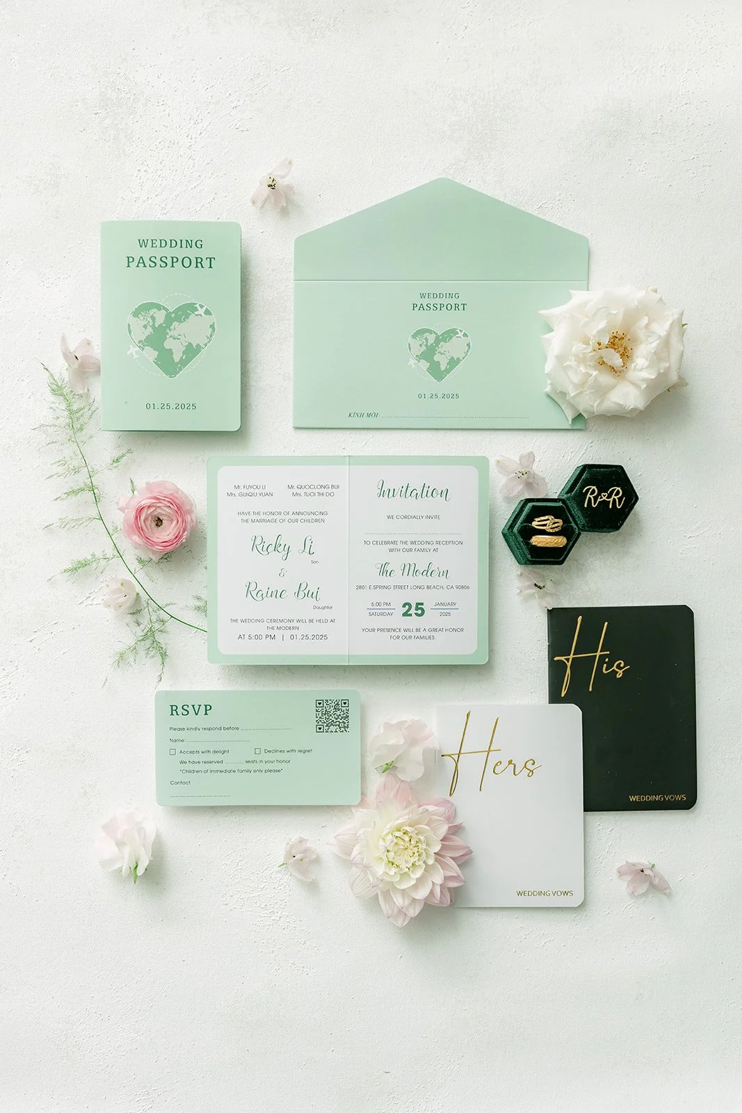 Mint green and white wedding invitation suite flat lay with blush flowers and ring box