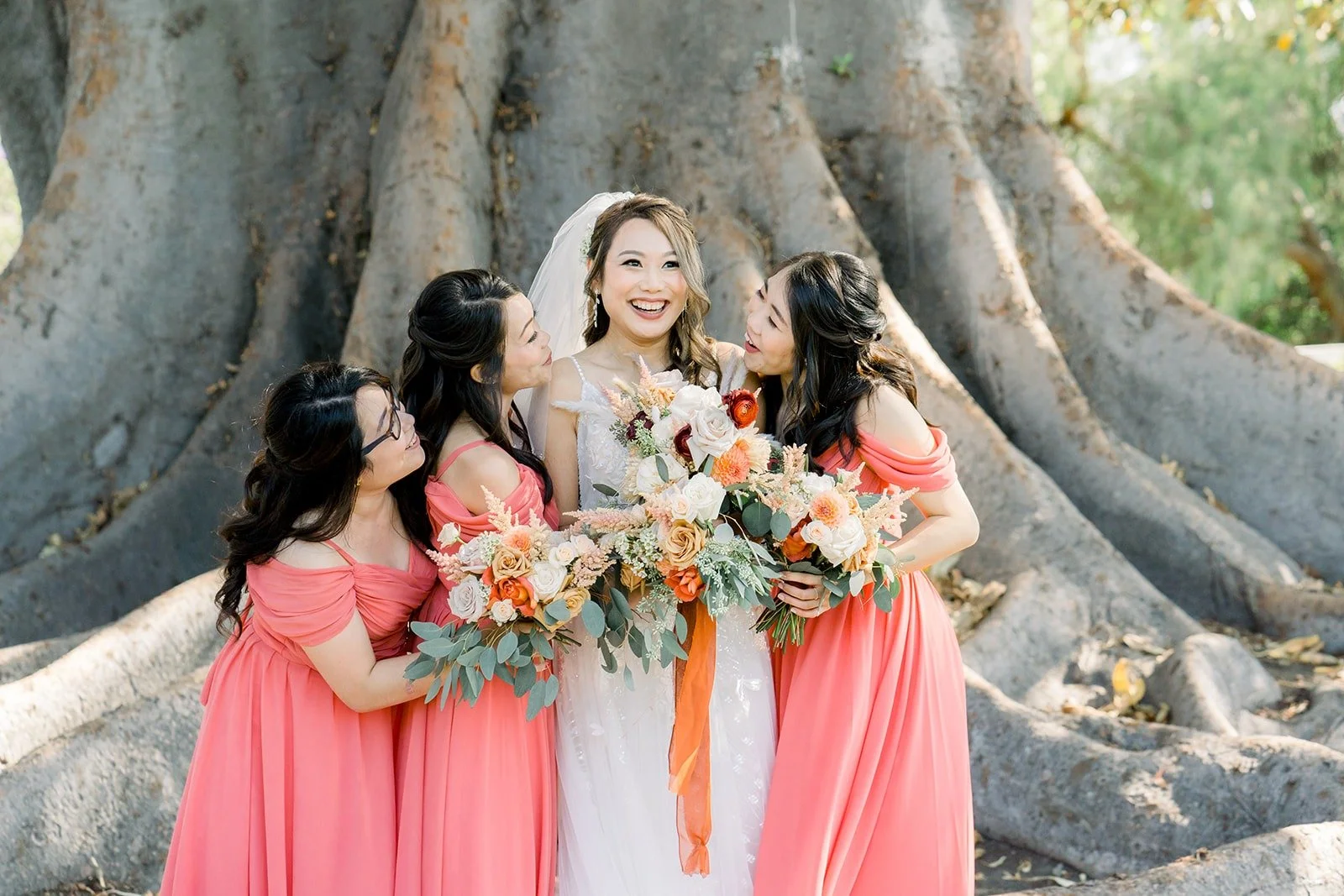 Ariel and her bridesmaids under the giant tree at Camarillo Ranch