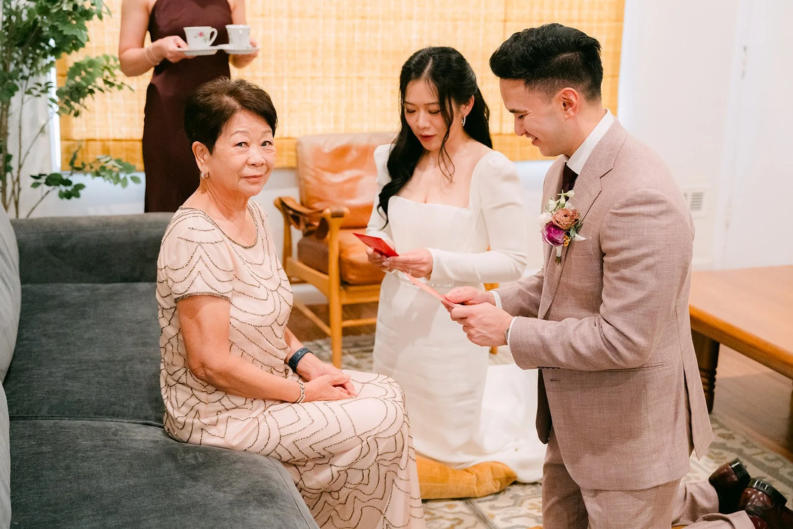 Denise's mom handing Michael a red envelope.