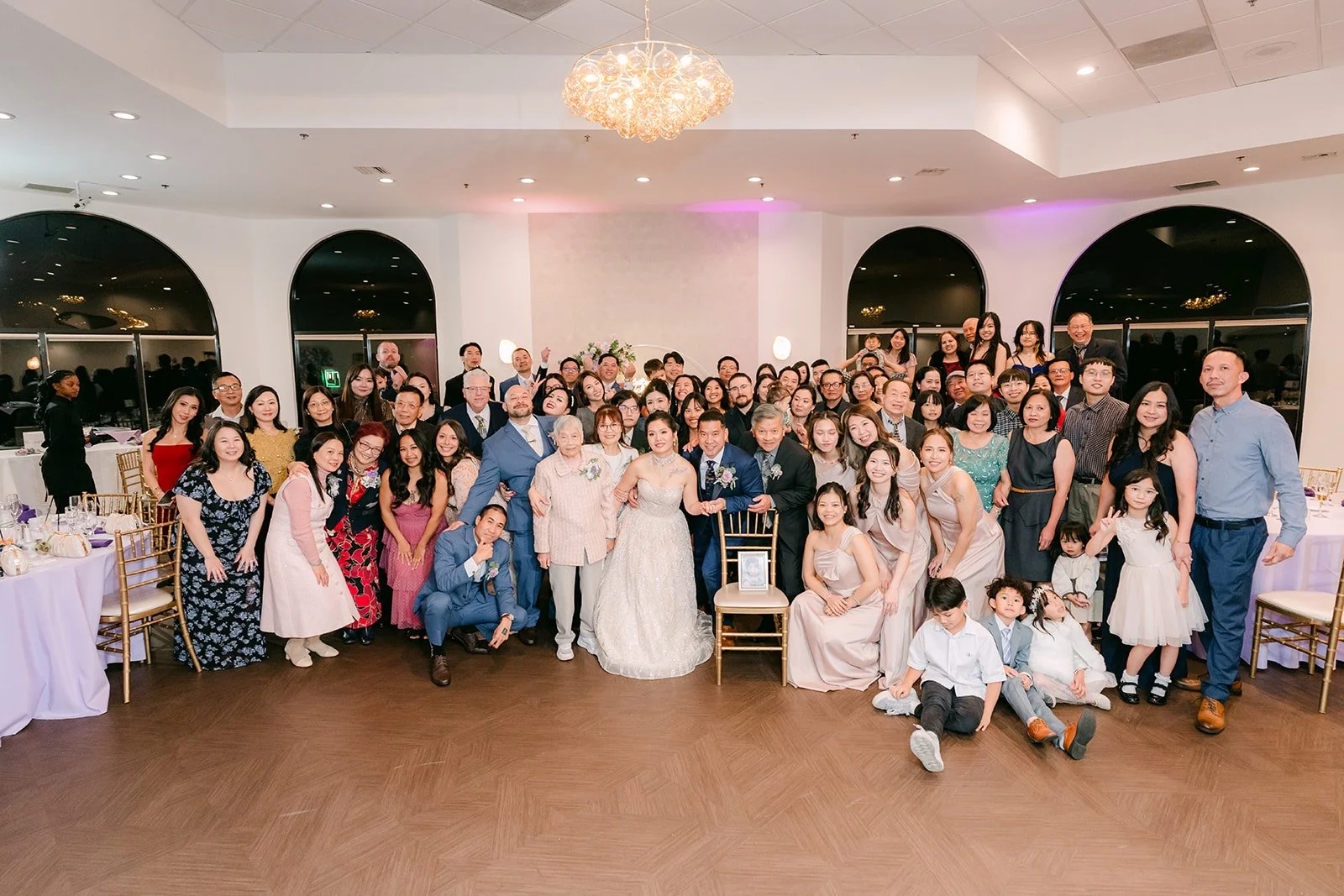 Guests gathered for a big group photo in the ballroom.