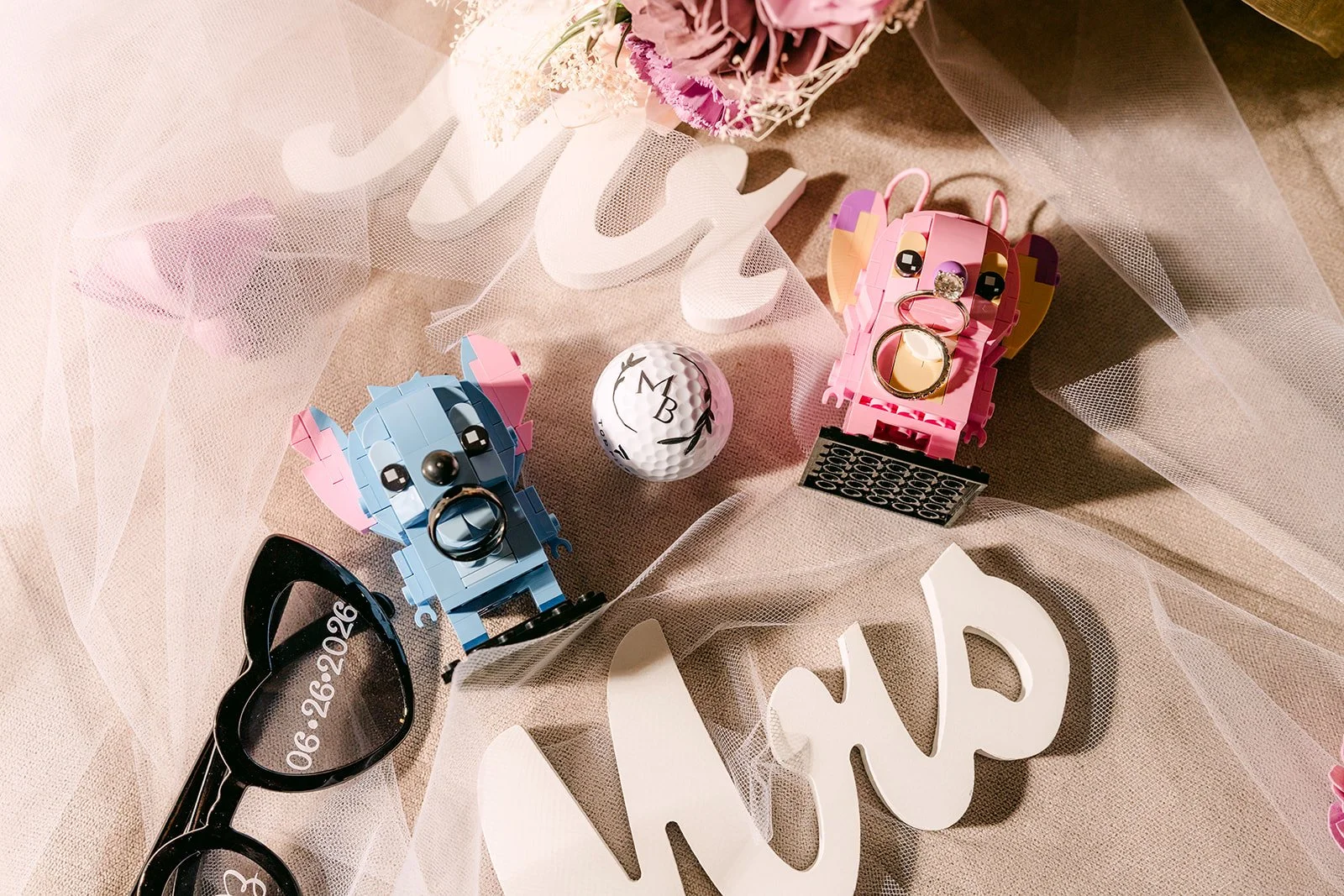 Mrs sign with glasses and toy figures.