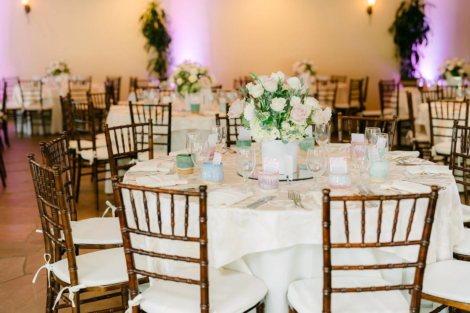 The ballroom at the Turnip Rose set for dinner with chiavari chairs