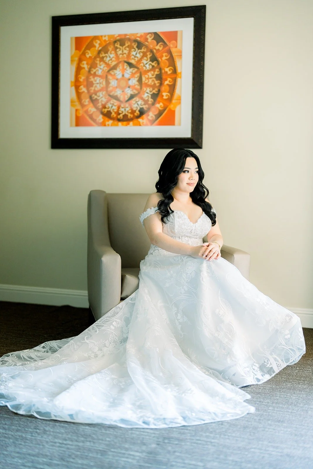 Francesca seated in her full gown with the skirt spread across the floor
