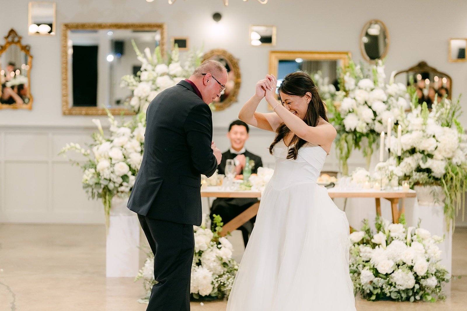 Jadee laughing during the father daughter dance, photographed by One and Only Production