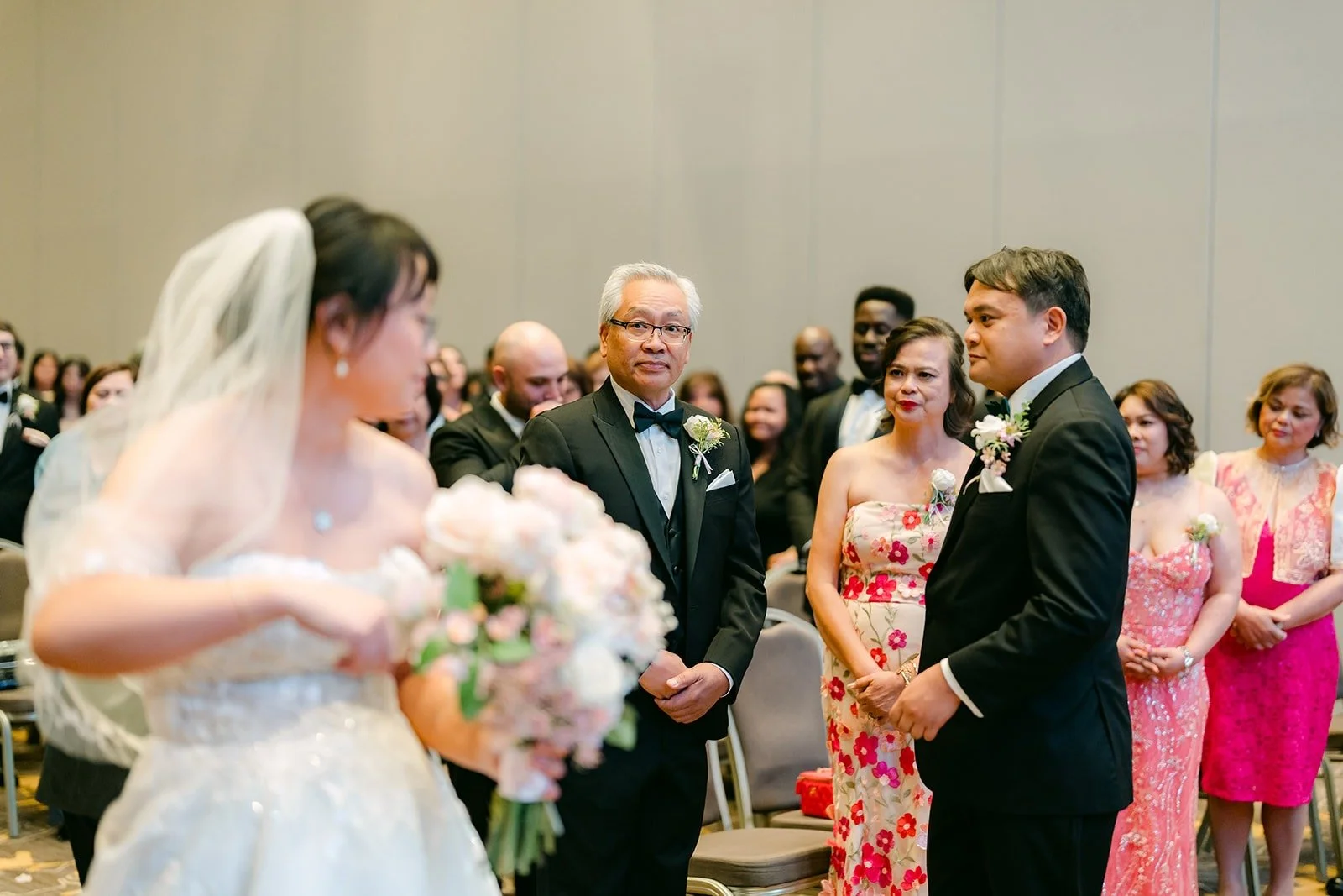 Stella arriving at the front of the aisle as James waits for her