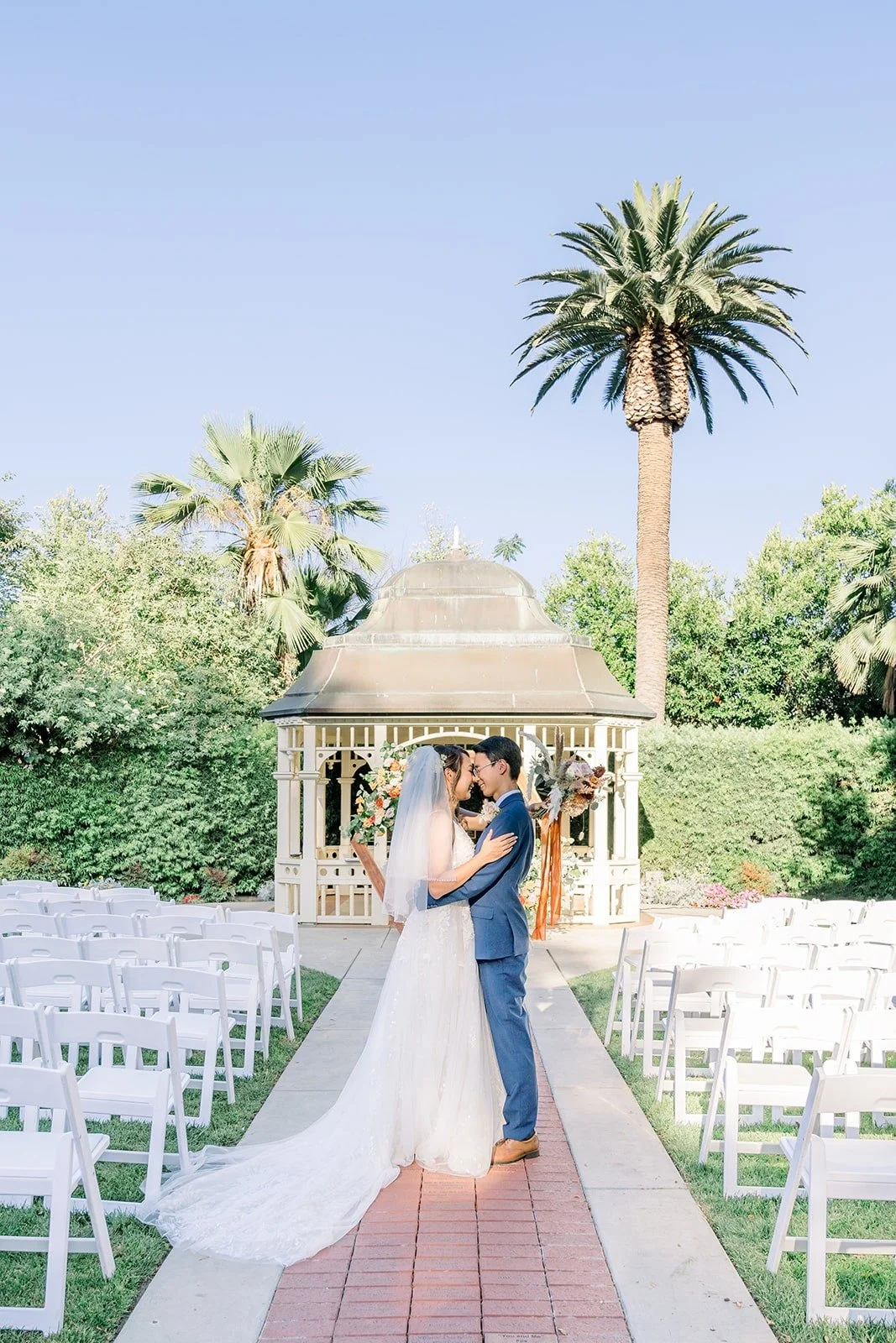Ariel and Alex in the aisle in front of the gazebo