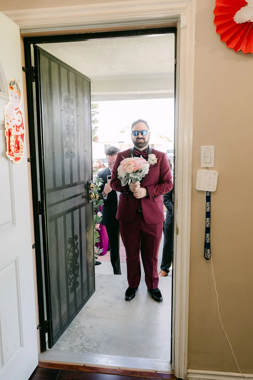 Ryan framed in the doorway as he enters the house.