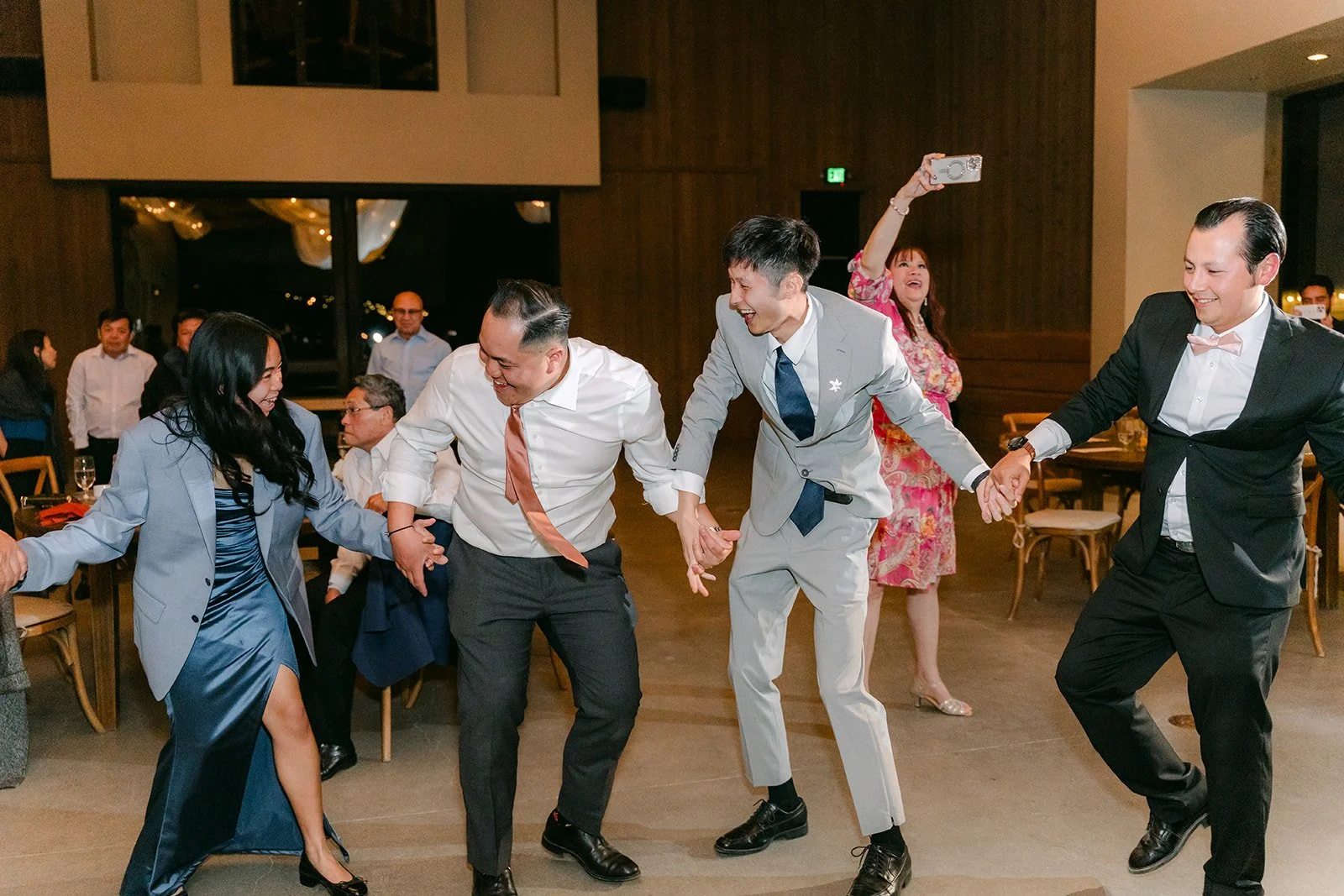 Guests dancing in a circle on the dance floor