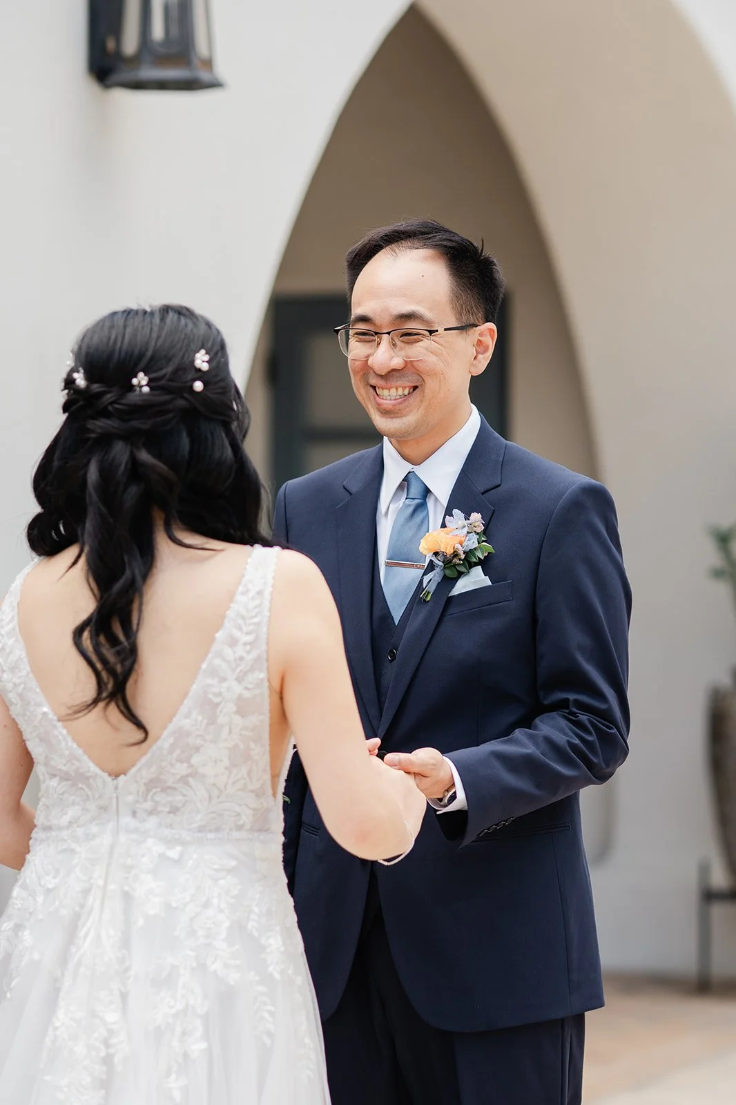 Lawrence holding Constance's hands and smiling after the first look