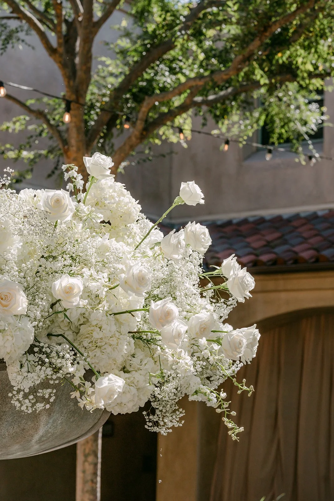 Close up of white hydrangea and baby's breath ceremony florals