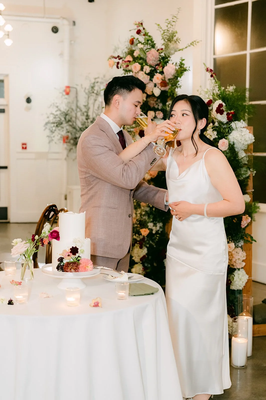 Michael feeding Denise a bite of cake.
