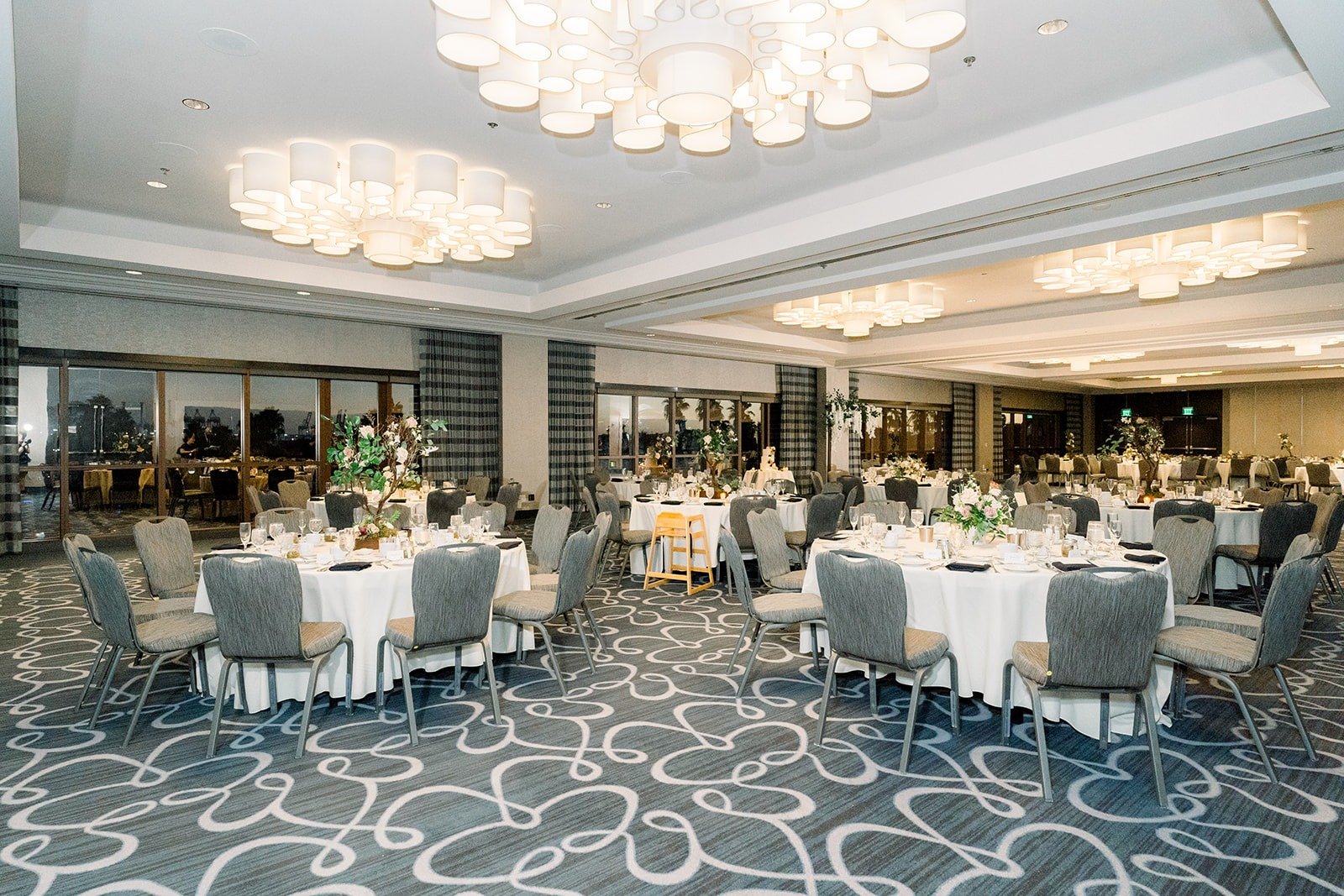 Round tables with white linens in the Beacon Ballroom