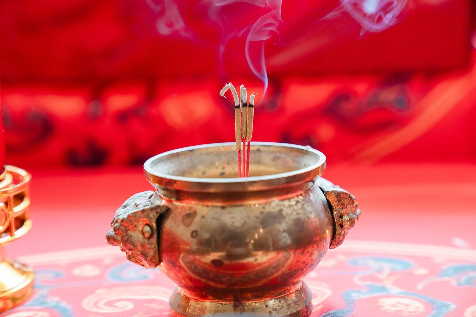 Incense rising from a brass burner on the morning of the tea ceremony, photographed by One and Only Production.