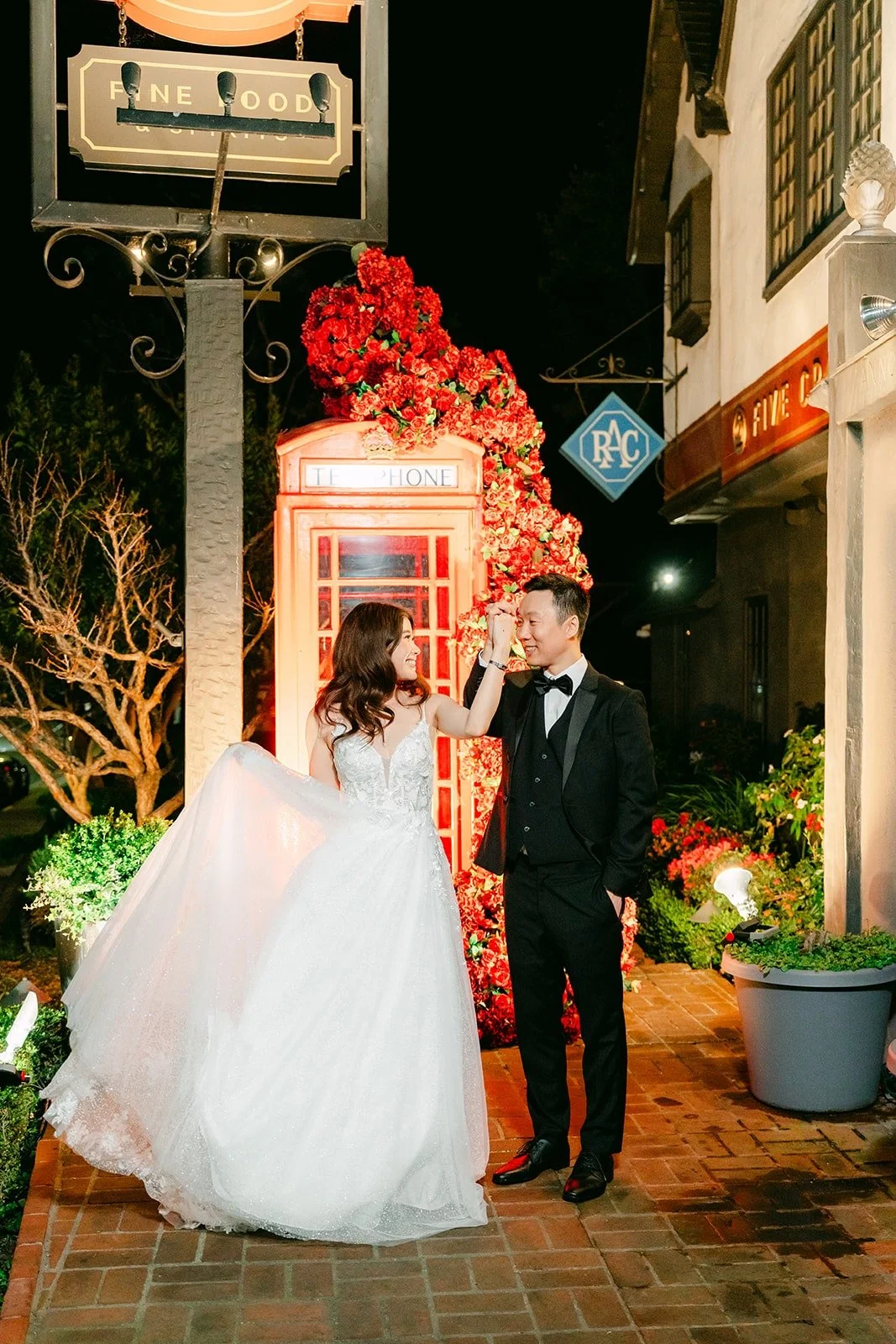 Valerie twirling her gown beside Jason outside Five Crowns