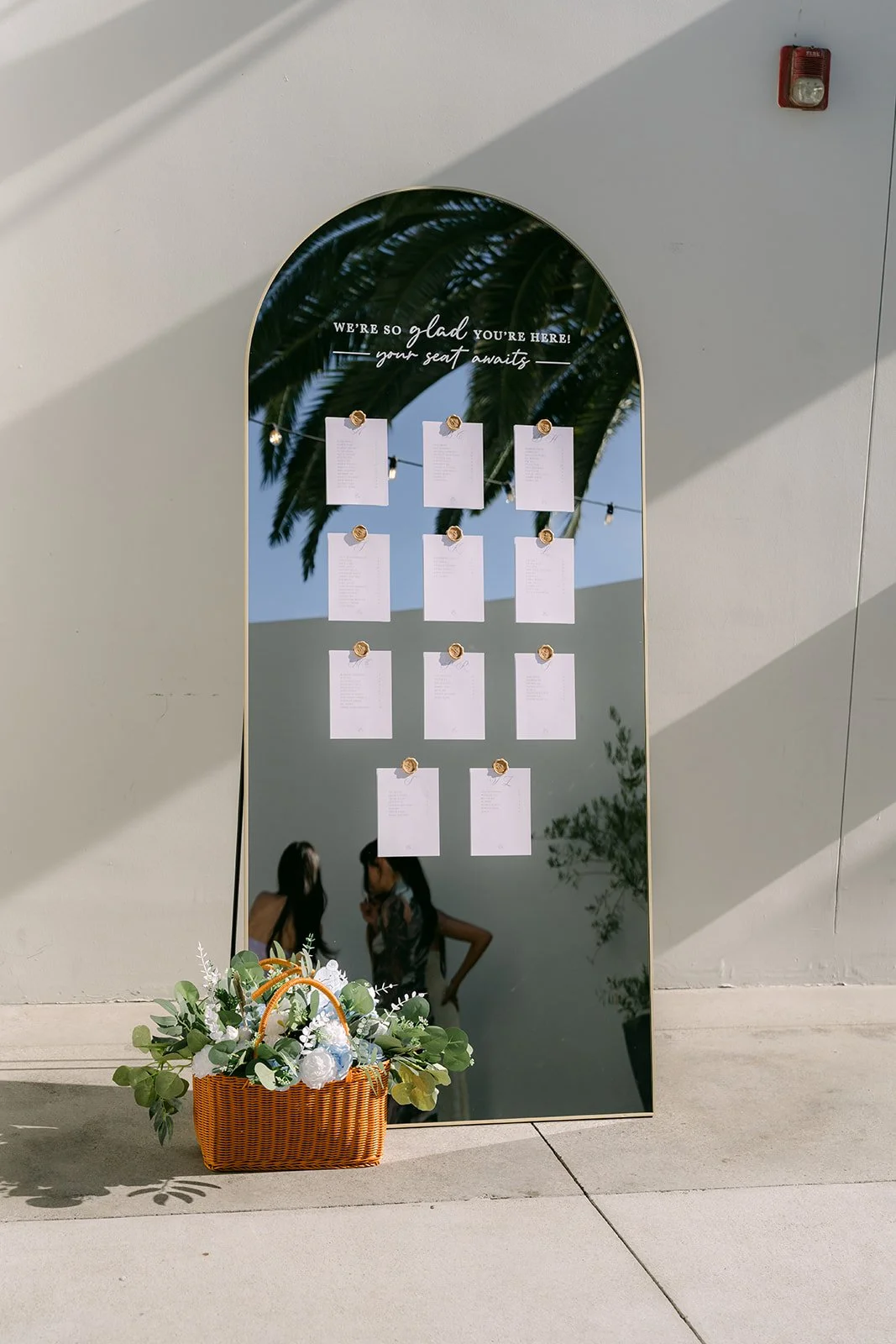 Seating chart displayed in a black arched frame