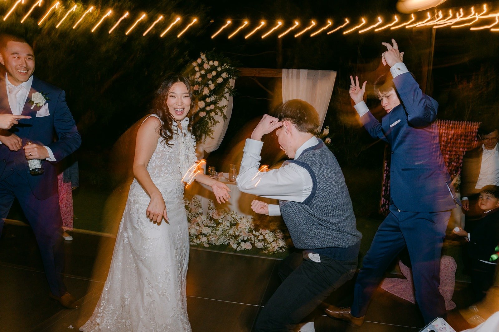 Guests dancing hard around Kelli on the dance floor